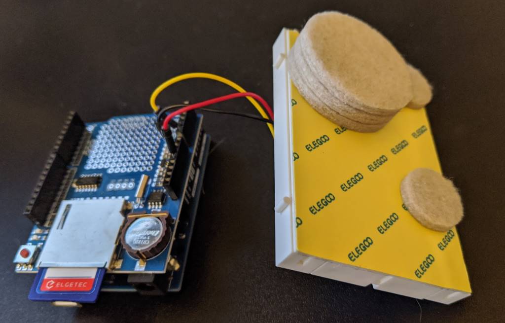 Felt pads attached to the underside of the breadboard